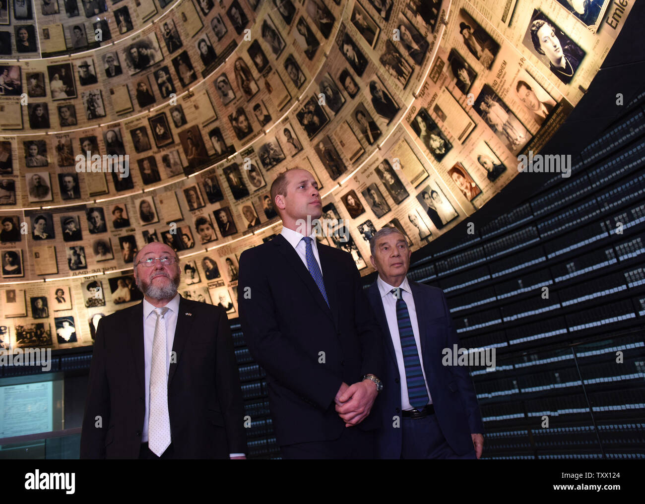 (C)Prince William, the Duke of Cambridge, is joined by (L) Chief Rabbi of the UK, Ephraim Mirvis, and (R) Chairman of Yad Vashem, Avner Shalev, in the Hall of Names in the Yad Vashem, the World Holocaust Remembrance Center, in Jerusalem, Israel, June 26, 2018.  Photo by Debbie Hill/UPI Stock Photo