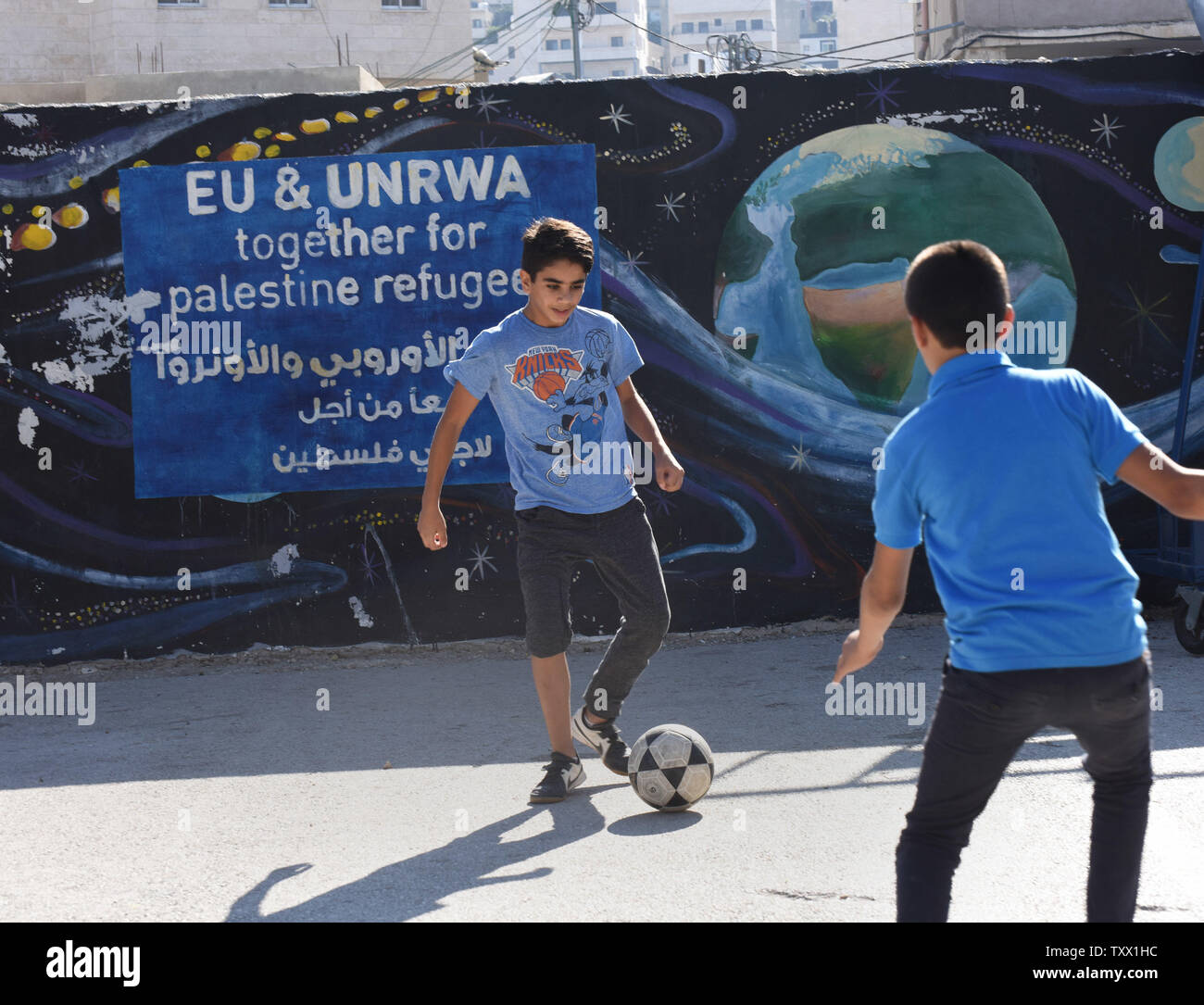 Palestinian boys play soccer in the courtyard of the UNRWA Boys School in the Deheishe Refugee Camp, near Bethlehem, West Bank, September 6, 2018. More than a thousand children, combined, attend the girls and separate boys school in grades one through nine. The United Nations Relief and Works Agency provides schools, food, health clinics and other essential services to over five million Palestinians in the West Bank, Gaza, Jordan, Syria and Lebanon. The U.S. President Donald Trump ended all funding to the UNRWA last week.  Photo by Debbie Hill/UPI Stock Photo