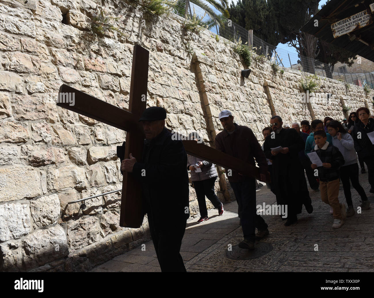 Christians Carry A Cross On The Via Dolorosa The Way Of The Cross On
