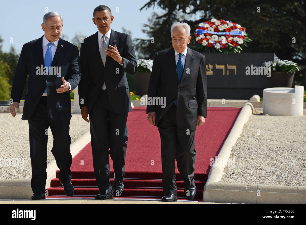 U.S. President Barack Obama walks with Israeli President Shimon Peres and Prime Minister Benjamin Netanyahu (L) during a visit to Mount Herzl on the west side of Jerusalem, Israel on March 22, 2013.  Theodor Herzl was the founder of the modern Zionist movement.  Obama is in the final day of his three-day visit to Israel and the Palestinian Territories.   UPI/Kobi Gideon/GPO Stock Photo