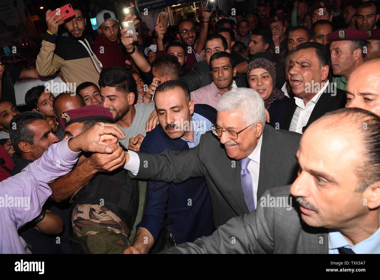 Palestinian President Mahmoud Abbas (Abu Mazen) shakes hands while on a tour of the city in Ramallah, West Bank on June 20, 2017.   Photo by Thaer Ghanaim/UPI Stock Photo