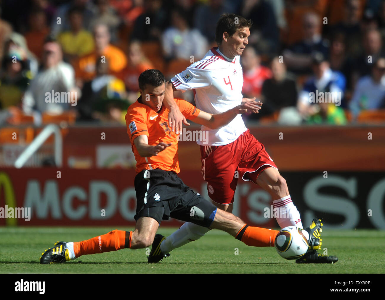 Robin Van Persie of Holland and Daniel Agger of Denmark during the Group D match at Soccer City in Johannesburg, South Africa on June 13, 2010. UPI/Chris Brunskill Stock Photo