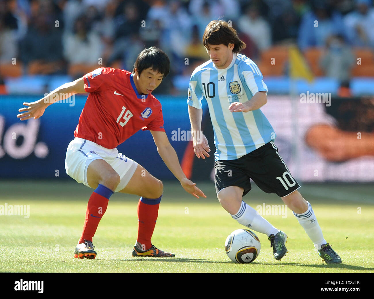 Lionel Messi of Argentina and Yeom Ki Hun of South Korea during the Group B match at Soccer City Stadium in Johannesburg, South Africa on June 17, 2010. UPI/Chris Brunskill Stock Photo