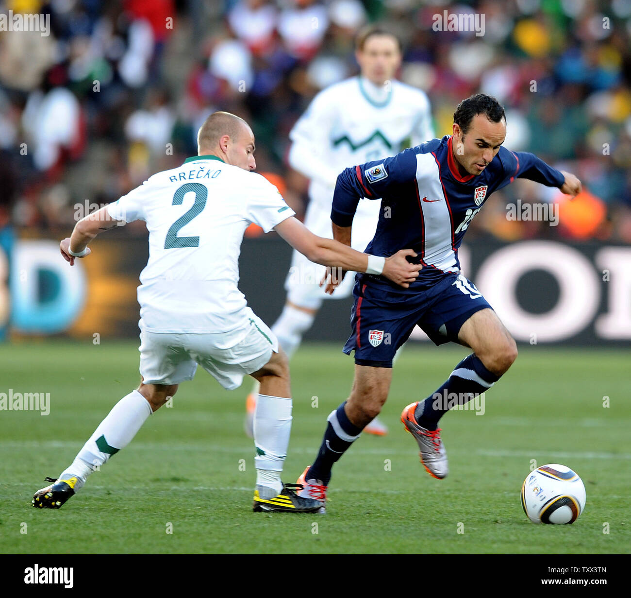 Miso Breckocof Slovenia and Landon Donovan of USA during the Group C match at Ellis Park in Johannesburg, South Africa on June 18, 2010. UPI/Chris Brunskill Stock Photo