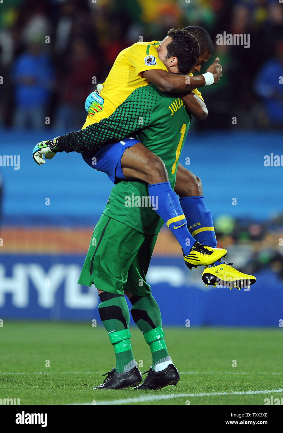 Michel Bastos of Brazil celebrates his side's opening goal with team-mate Julio Cesar during the FIFA World Cup Round of 16 match at Ellis Park in Johannesburg, South Africa on June 28, 2010. UPI/Chris Brunskill Stock Photo