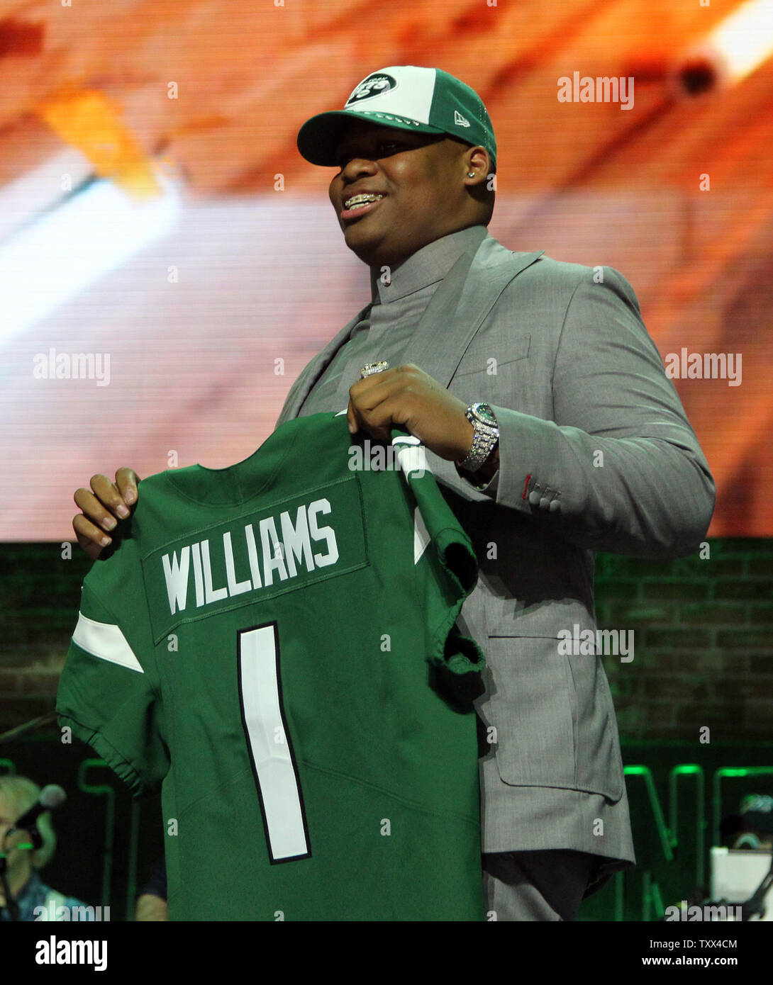 Quinnen Williams from Alabama holds up his jersey after being picked number  three over all by Jets in the 2019 NFL Draft in Nashville, Tennessee on  April 25, 2019. Photo by John
