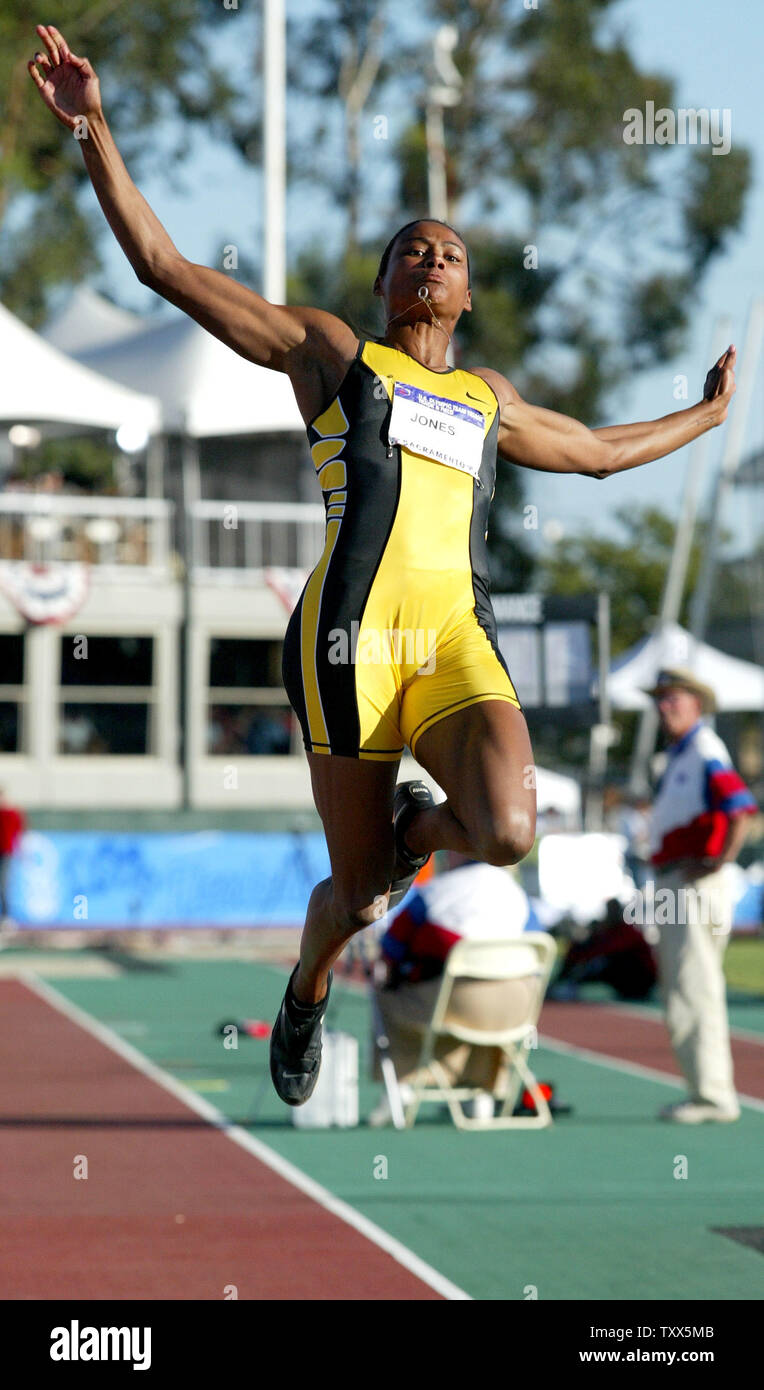 Marion Jones second jump in the women's long jump competition at the U.S. 2004 Olympic Team Track and Field trials. Sacramento, California Thursday, July 15, 2004. Jones leaped a distance of 22 feet 4 inches in the jump and win the competition qualifying for the Olympic team  (UPI/Ken James) Stock Photo