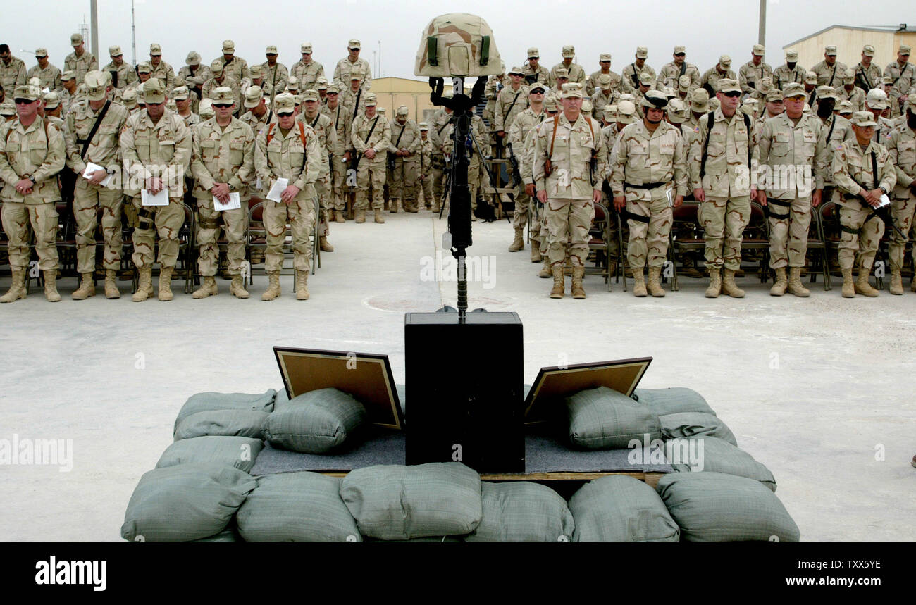 A memorial service is held for Corporal Glenn Watkins, a member of A Company 1-184TH Infantry, Californian Army National Guard, attached to 4th Brigade of the 3ID at Camp Falcon in Baghdad, Iraq on April 9, 2005.  Corporal Glenn Watkins was killed Tuesday by a VBIED (vehicle-based improvised explosive device) south of Baghdad.      (UPI Photo/ Ken James) Stock Photo