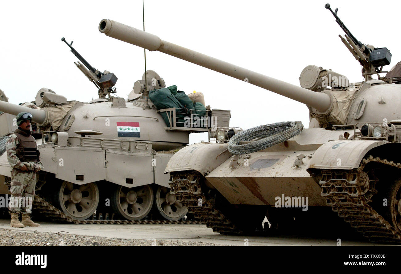 The first Iraqi Army Mechanized unit with T-55 tanks and 16 MTLV arrives at Forward Operation Base Falcon to conduct operations in southern Baghdad, Iraq during operations February 20, 2005. President George W. Bush in a news conference April 28, 2005 reported reported headway in recruiting, equipping and organizing Iraqi forces to take over the fight against the insurgents two years after the US-led invasion toppled Saddam Hussein.  (UPI Photo/Ken James/File)   Top of Form 1 Stock Photo