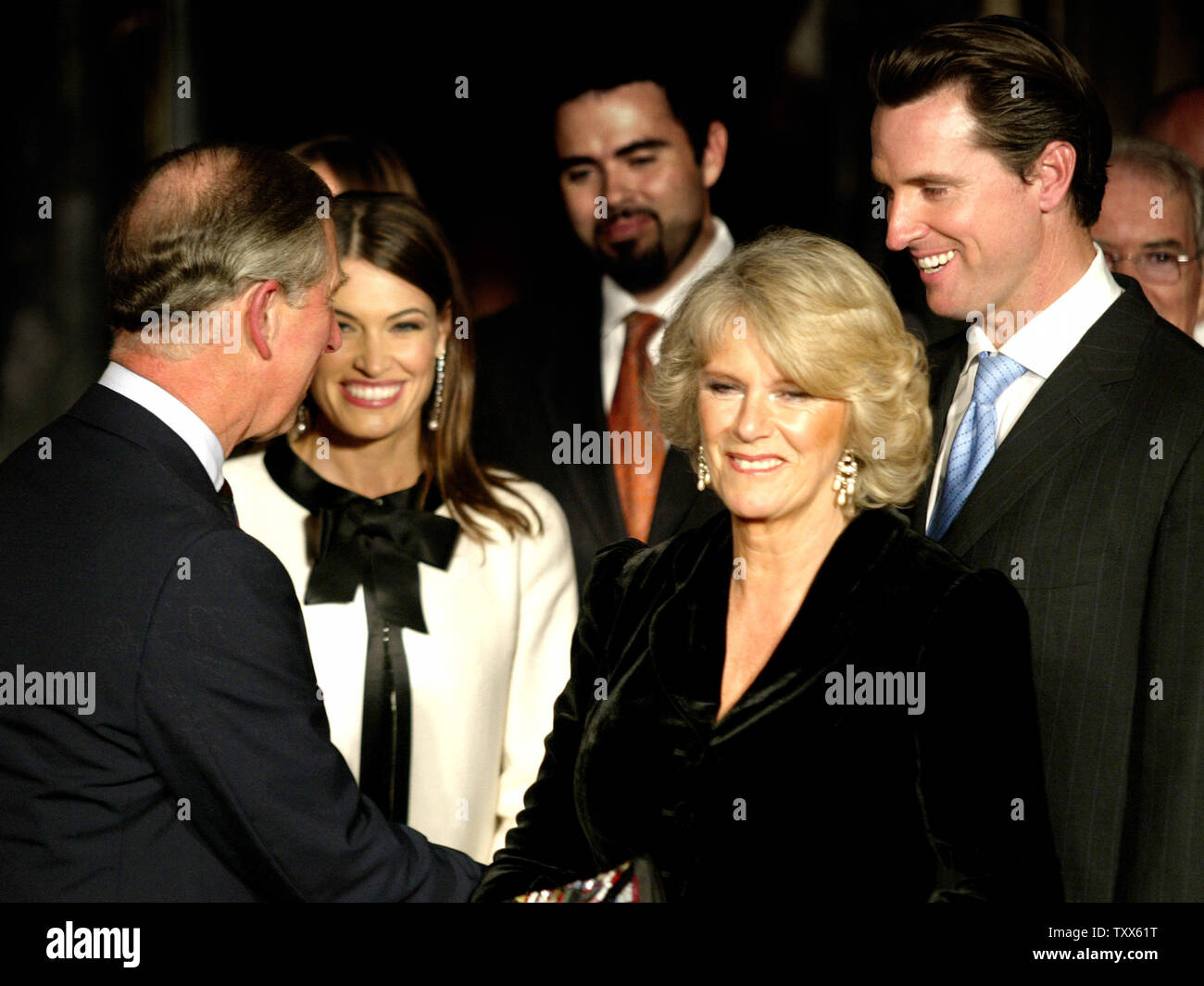 Prince Charles, The Prince of Wales (L), and his wife Camilla, The Duchess of Cornwall (2nd R) talk with San Francisco Mayor Gavin Newsom (R) and his wife Kimberly (2nd L)after attending a performance of Beach Blanket Babylon at Club Fugazi in San Francisco  on November 6, 2005. (UPI Photo/Ken James) Stock Photo