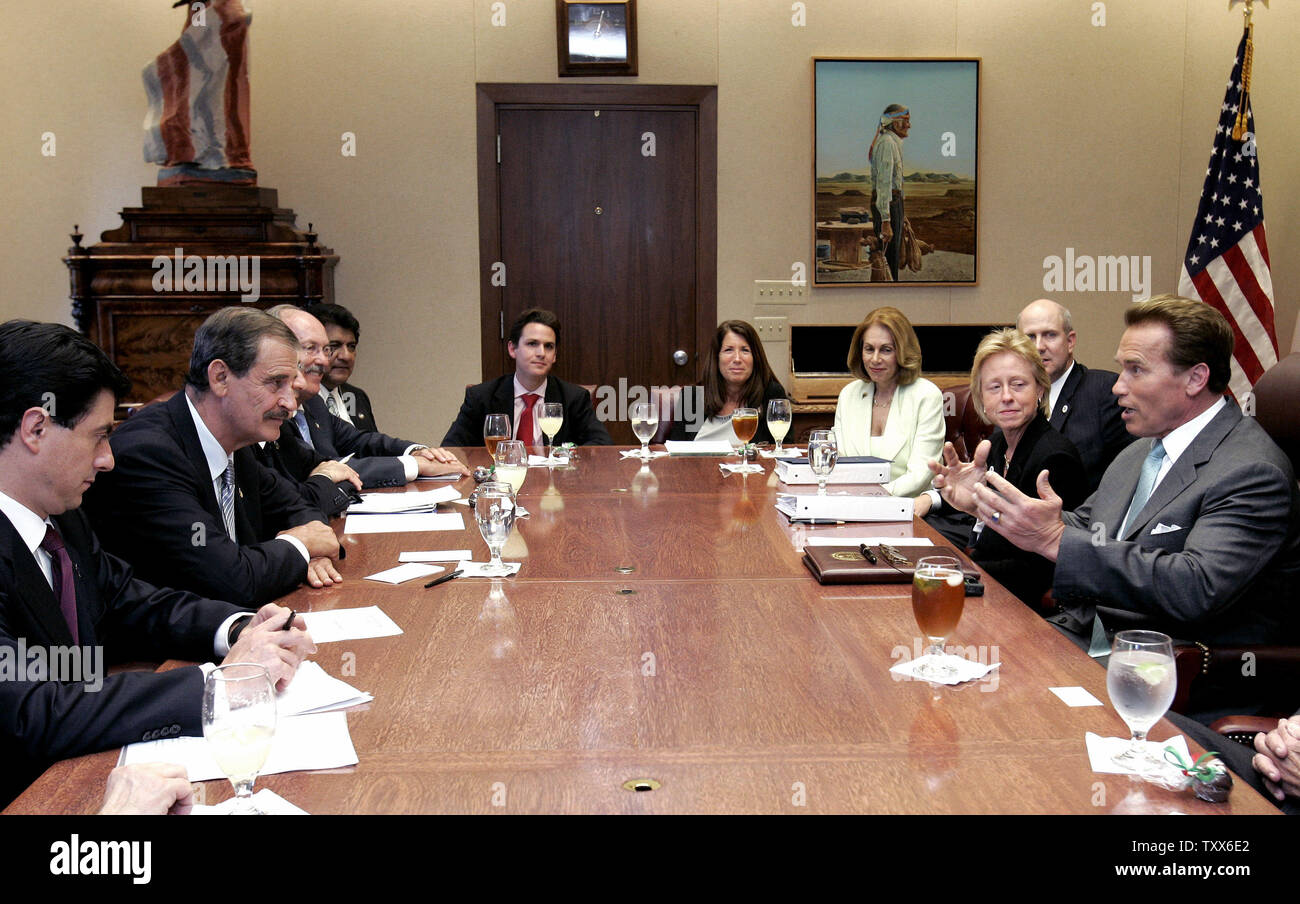 California Governor Arnold Schwarzenegger, right, talks with Mexican  President Vicente Fox, second from left, during a meeting held at the Governor's  office at the Capitol in Sacramento California on Thursday May 25,