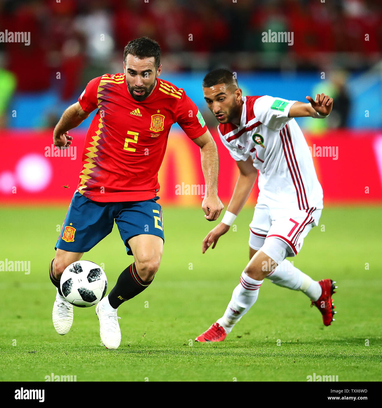 Dani Carvajal (L) of Spain competes with Hakim Ziyach of Morocco during the 2018 FIFA World Cup Group B match at Kaliningrad Stadium in Kaliningrad, Russia on June 25, 2018. The game finished in a 2-2 draw. Photo by Chris Brunskill/UPI Stock Photo
