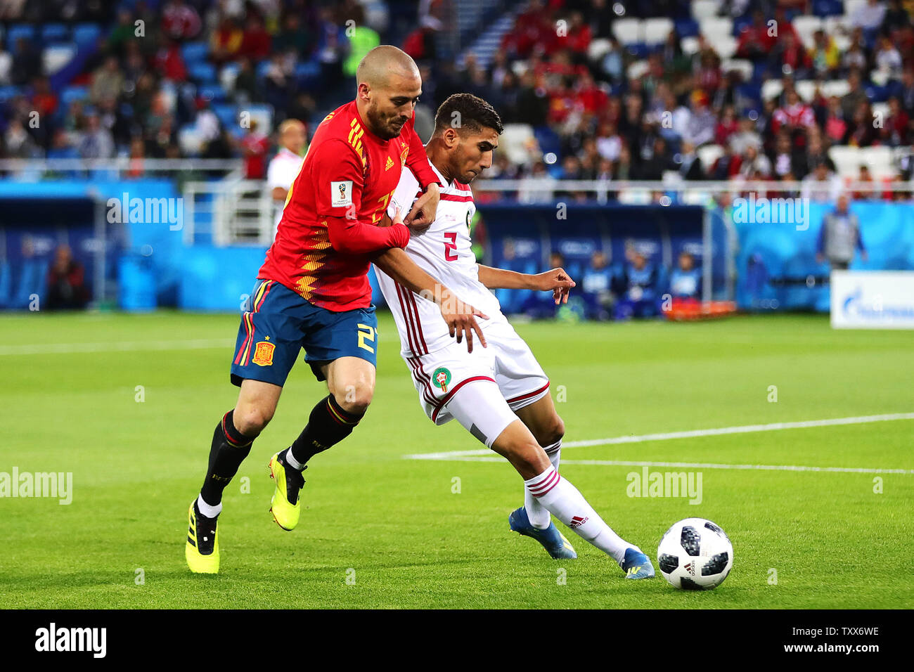 David Silva (L) of Spain competes with Achraf Hakimi of Morocco during the 2018 FIFA World Cup Group B match at Kaliningrad Stadium in Kaliningrad, Russia on June 25, 2018. The game finished in a 2-2 draw. Photo by Chris Brunskill/UPI Stock Photo