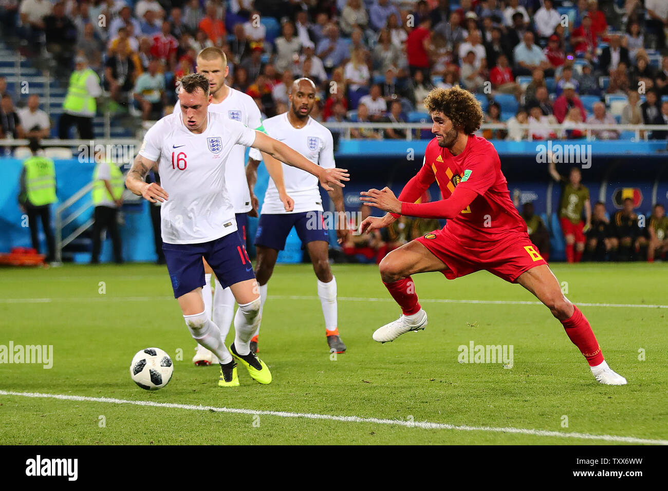 Phil Jones (L) of England competes for the ball with Marouane Fellaini of Belgium during the 2018 FIFA World Cup Group G match at Kaliningrad Stadium in Kaliningrad, Russia on June 28, 2018. Belgium won the match 1-0. Photo by Chris Brunskill/UPI Stock Photo