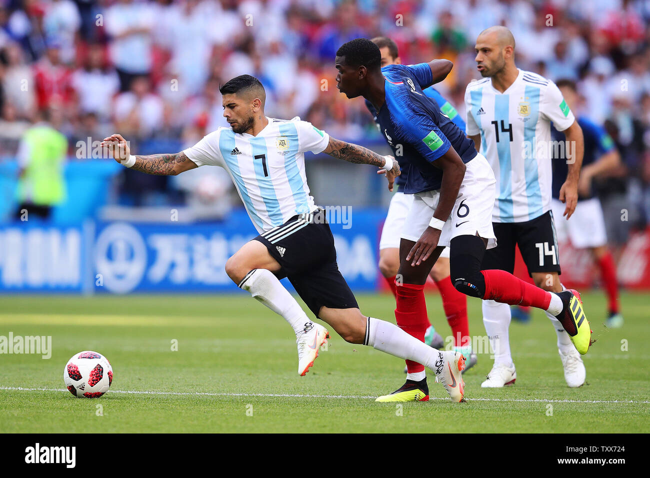 Paul Pogba (R) of France competes for the ball with Ever Banega of  Argentina during the 2018 FIFA World Cup Round of 16 match at Kazan Arena  in Kazan, Russia on June