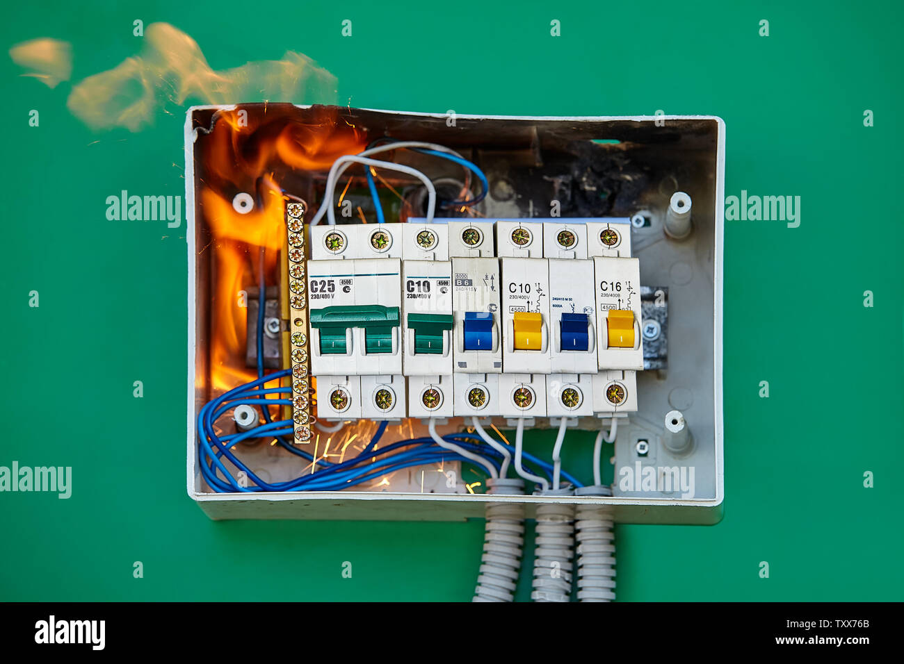 Conductor came loose at automatic circuit breaker which caused arcing