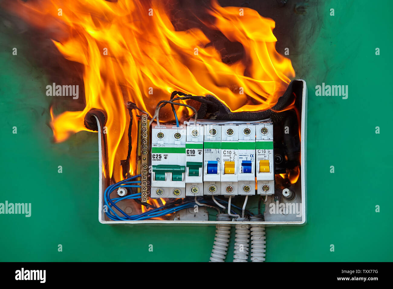 Damaged circuit breaker became the cause of electrical short circuit and  caused the switchboard to ignite of fire. Bad electrical wiring systems  cause Stock Photo - Alamy