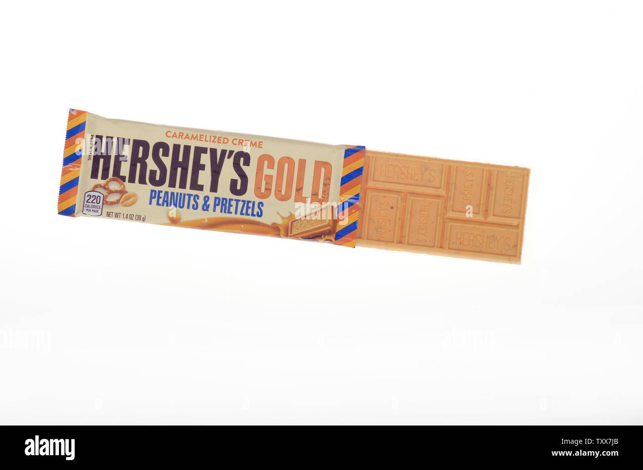 Hershey’s Gold peanuts & pretzels candy bar with wrapper opened Stock