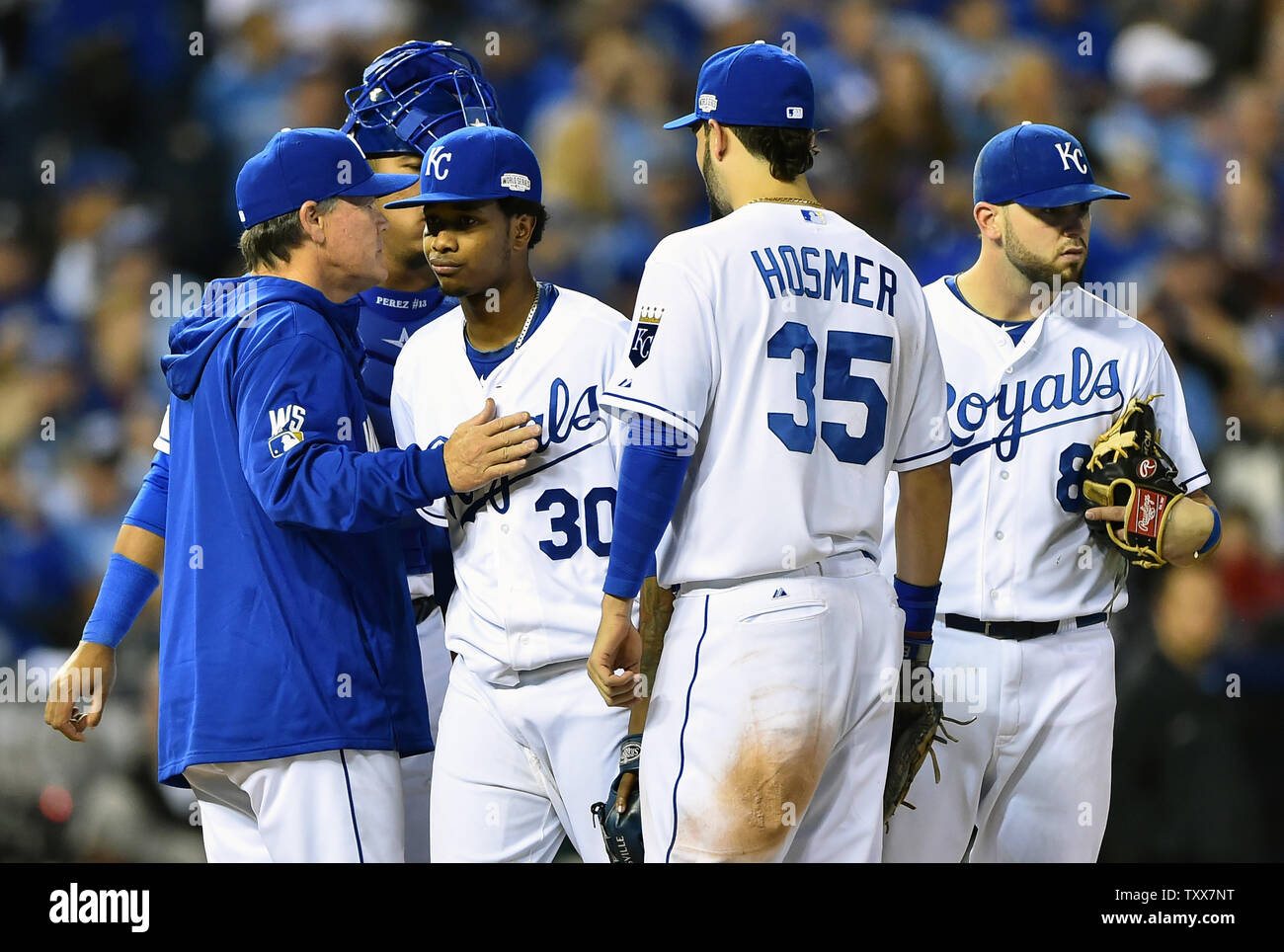 Kansas City Royals manage Ned Yost (L) relieves rookie starting