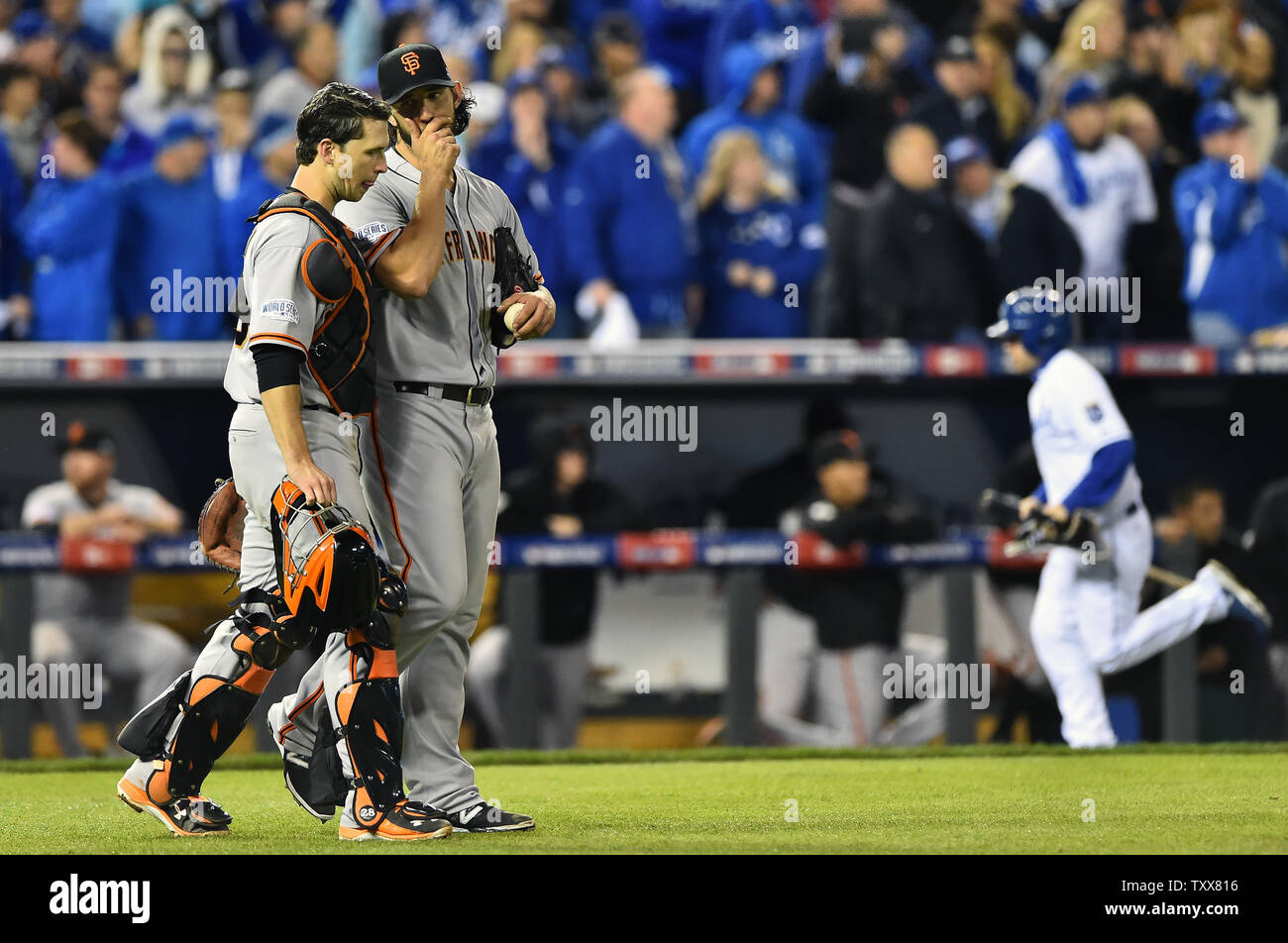 San Francisco Giants pitcher and World Series MVP Madison Bumgarner (R)  hugs his catcher Buster Posey after the final out in game 7 of the World  Series at Kauffman Stadium in Kansas