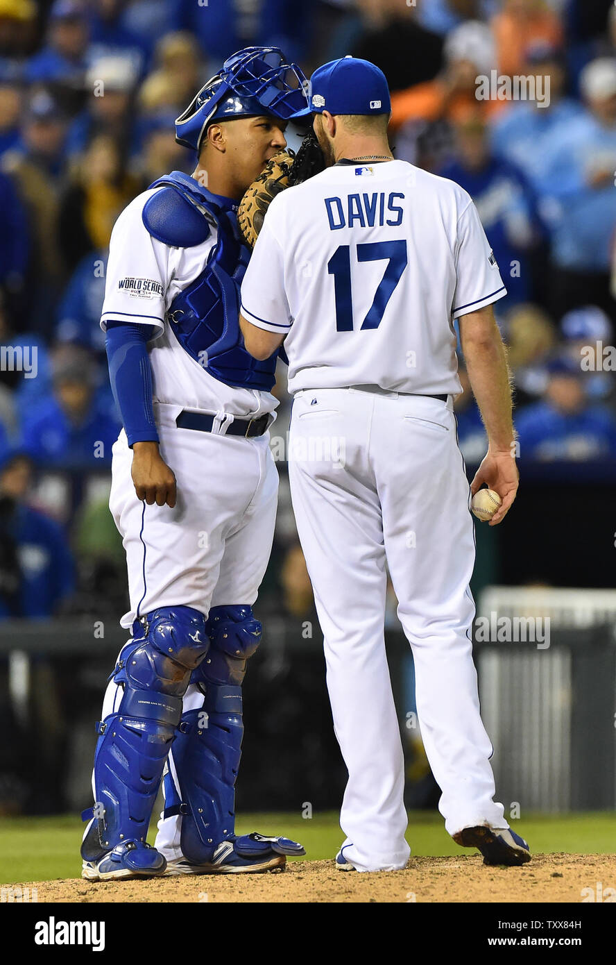 Kansas City Royals catcher Salvador Perez talks with reliever Wade Davis  with one San Francisco Giants runner on second during the eighth inning of  game 7 of the World Series at Kauffman