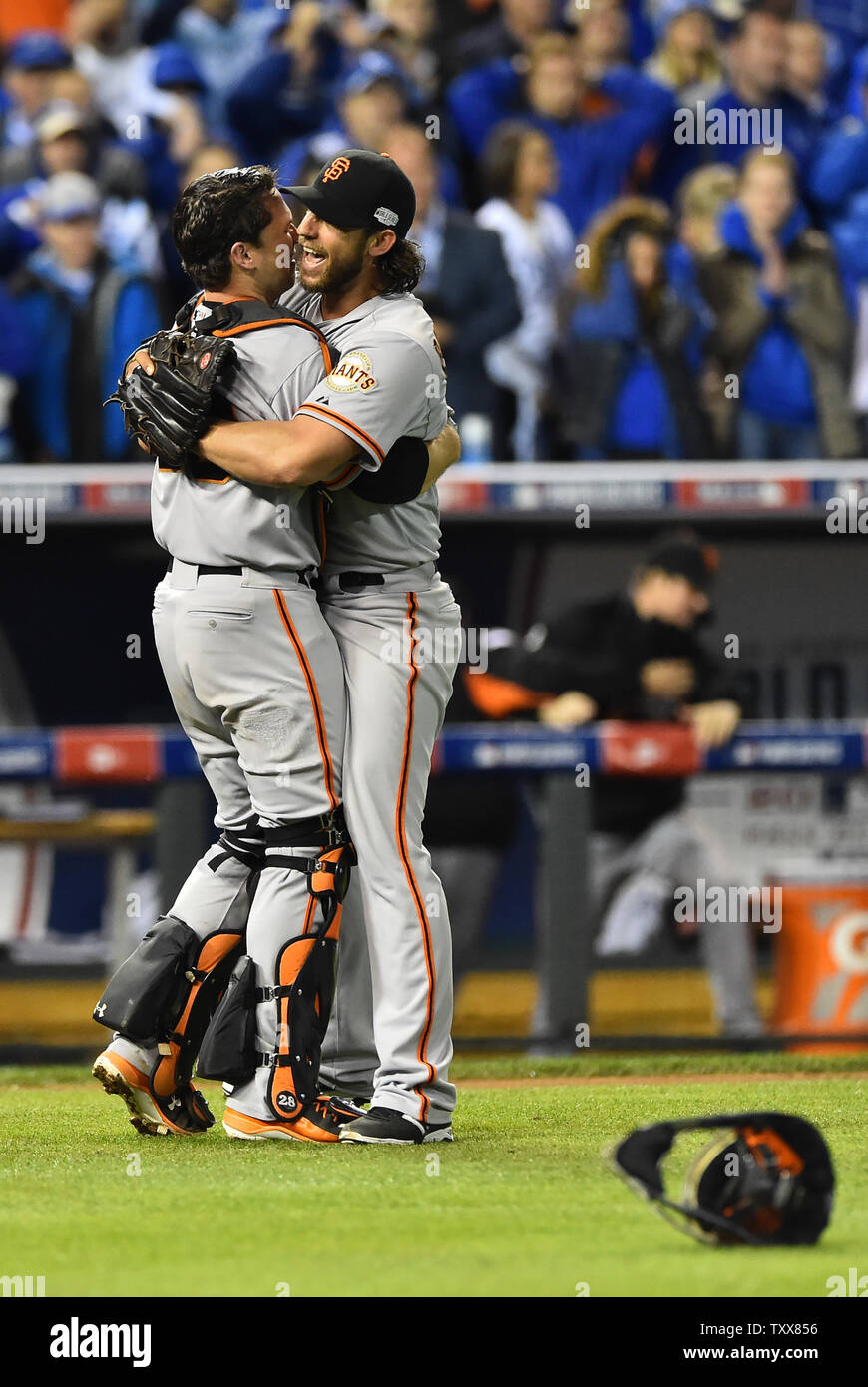 San Francisco Giants pitcher and World Series MVP Madison Bumgarner (R)  hugs his catcher Buster Posey after the final out in game 7 of the World  Series at Kauffman Stadium in Kansas