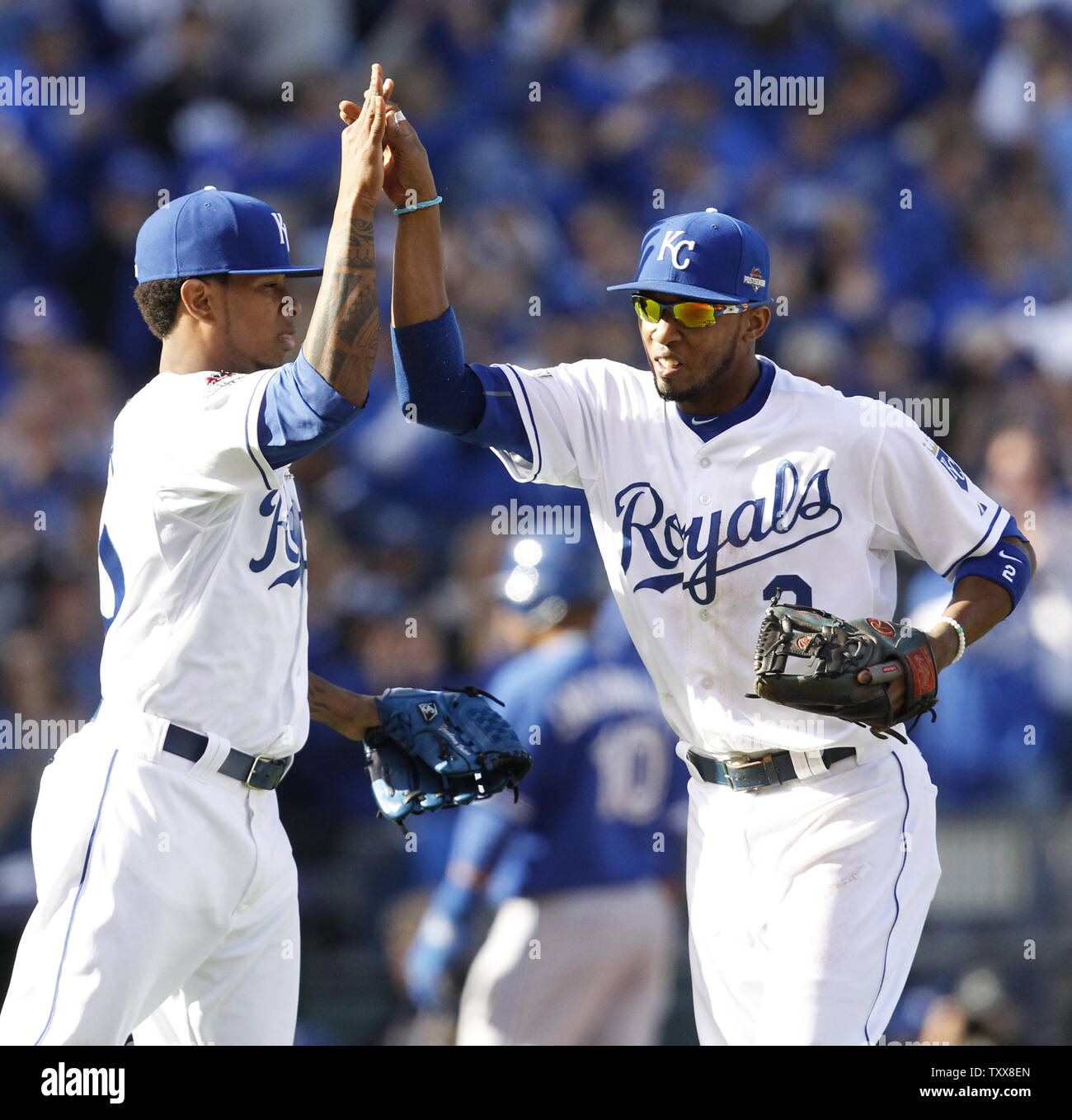 Kansas City Royals Yordano Ventura (L) high fives shortstop Alcides Escobar after a diving catch catch by Escobar of a liner by Toronto Blue Jays Russell Martin lead to a double play in the second inning of game 2 of the American League Championship Series at Kauffman Stadium in Kansas City, Missouri on October 17, 2015.      Photo by Jeff Moffett/UPI Stock Photo