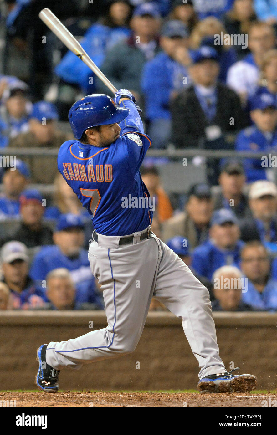 New York Mets catcher Travis d'Arnaud singles home teammate Daniel Murphy who scored from third base during the fourth inning against the Kansas City Royals in game 1 of the World Series at Kauffman Stadium in Kansas City, Missouri on October 27, 2015. The Royals will play the New York Mets in the 2015 World.  Photo by Kevin Dietsch/UPI Stock Photo