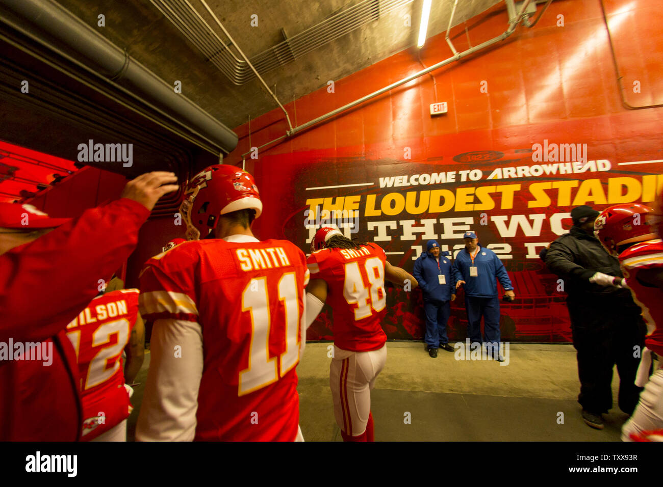 Kansas City Chiefs head coach Andy Reid taps the helmet of Kansas City