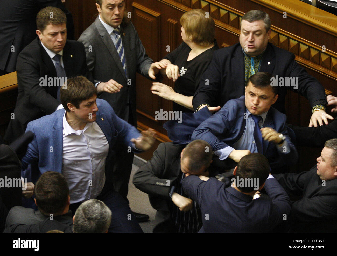 Ukrainian lawmakers from Communist Party and the radical nationalist right-wing Svoboda (Freedom) Party fight during a parliament session in Kiev on April 8, 2014.    The fight was provoked by different opinions on what is causing the unrest in eastern Ukraine.   UPI/Ivan Vakolenko Stock Photo