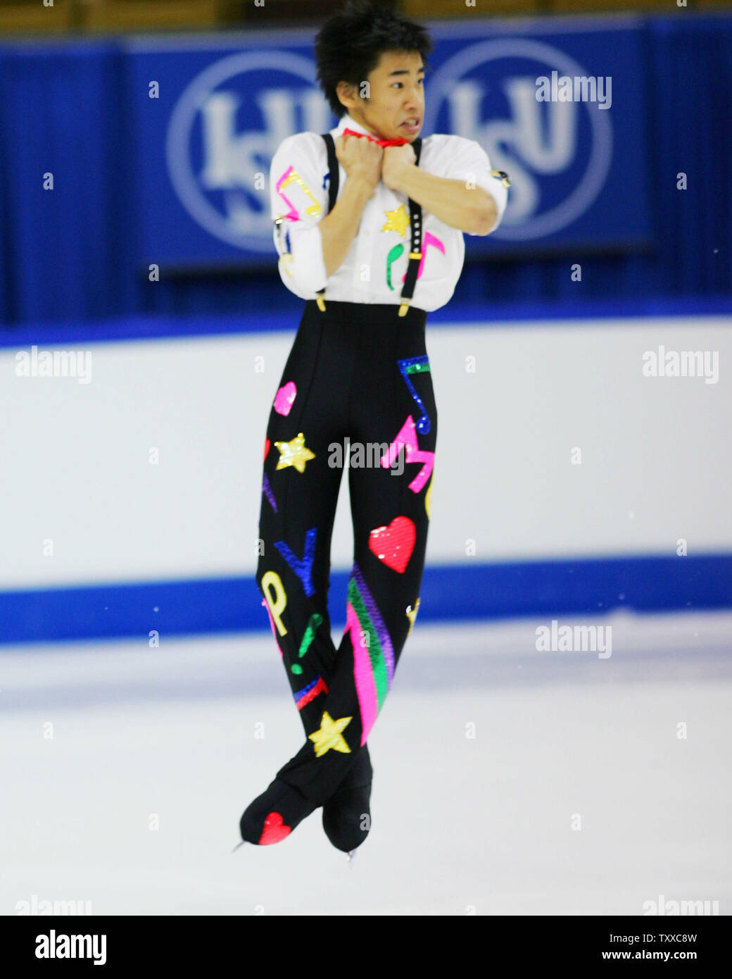 Japanese skater Nobunari Oda, 17, performs a triple lutz jump during