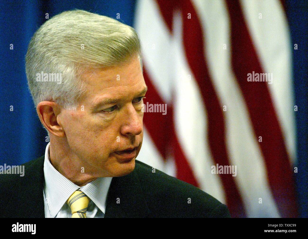 California Gov. Gray Davis laughs as he holds up a jersey of