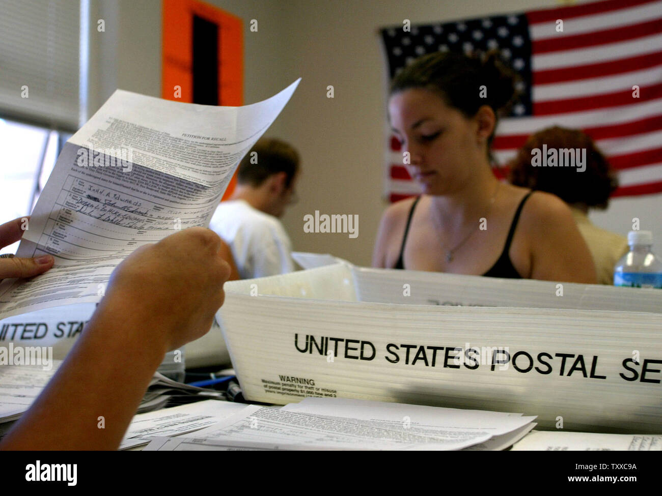 SCP2003071103 - SACRAMENTO, CALIFORNIA, July 11 (UPI) -- Staff at the Rescue California Office open some the 6,000 to 15,000 petitions received daily to recall California's Governor Gray Davis July 11 2003. The Rescue California Office Have received over 1.3 million signed petitions to recall the  Governor.    mk/Ken James     UPI Stock Photo