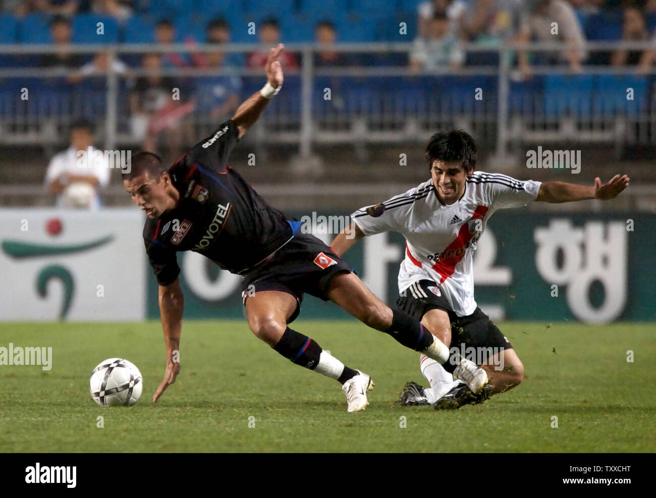 Hatem Ben Arfa (L) of Lyonnais, France, and Villagra of River Plate, Argentine, battle for the ball in the second half on the sixth day of the Peace Cup Korea 2007 at the Suwon Worldcup Stadium, South Korea, on July 19, 2007. Lyonnais beat River Plate 3-1. (UPI Photo/Keizo Mori) Stock Photo