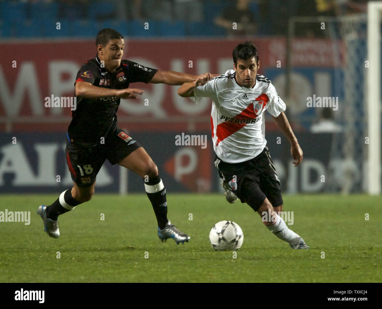 Hatem Ben Arfa (L) of Lyonnais, France, struggles for the ball with Ferrari (R) of River Plate, Argentine, in the second half on the sixth day of the Peace Cup Korea 2007 at the Suwon Worldcup Stadium, South Korea, on July 19, 2007. Lyonnais beat River Plate 3-1. (UPI Photo/Keizo Mori) Stock Photo