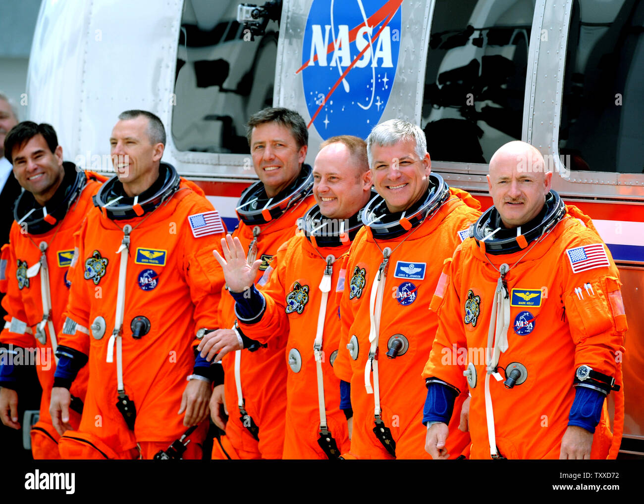 Space Shuttle Endeavour Commander Mark Kelly (right) departs with his crew and boarding the Astrovan on their way to the launchpad for Endeavour's last flight at Kennedy Space Center on April 29, 2011.  The launch attempt was scrubbed minutes later. Behind Kelly is Pilot Greg Johnston and mission specialists  Mike Finke and Roberto Vittori, Drew Feustel, and Greg Chamitoff (left).  Kelly is the husband of Arizona Congresswoman Gabrielle Giffords, who was recovering from an assassination attempt and at the Cape to watch the possible liftoff.   UPI/ Pat Benic Stock Photo