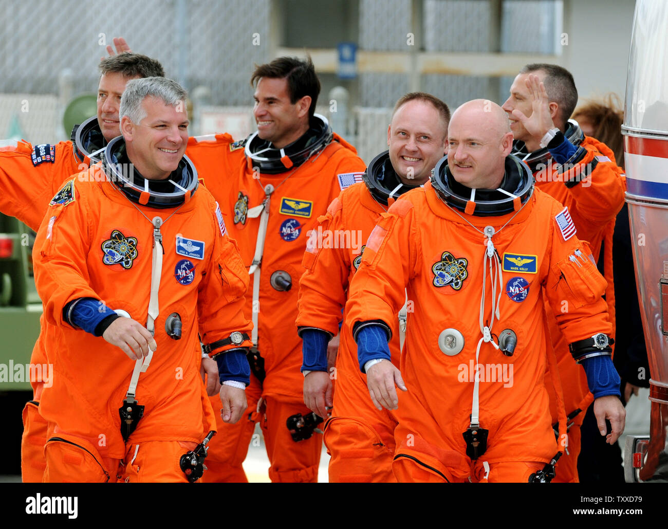Space Shuttle Endeavour Commander Mark Kelly (right) and Pilot Greg Johnson (right) lead their crew to the Astrovan on their way to the launchpad for Endeavour's last flight at Kennedy Space Center on April 29, 2011.  The launch attempt was scrubbed minutes later. Behind Kelly and Johnson are mission specialists  (L-R) Roberto Vittori, Greg Chamitoff, Mike Finke and Drew Feustel.  Kelly is the husband of Arizona Congresswoman Gabrielle Giffords, who was recovering from an assassination attempt and at the Cape to watch the possible liftoff.   UPI/ Pat Benic Stock Photo