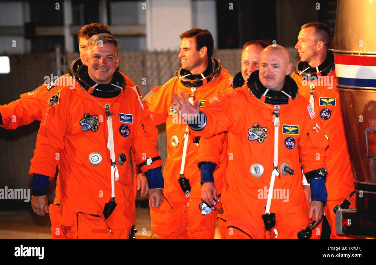 Space Shuttle Endeavour Commander Mark Kelly (right) and Pilot Greg Johnston (left) lead their crew before boarding the Astrovan on their way to the launchpad for Endeavour's last flight at Kennedy Space Center on May 16, 2011.    Kelly is the husband of Arizona Congresswoman Gabrielle Giffords, who is recovering from an assassination attempt, and at the Cape to watch the possible liftoff.   UPI/Pat Benic Stock Photo