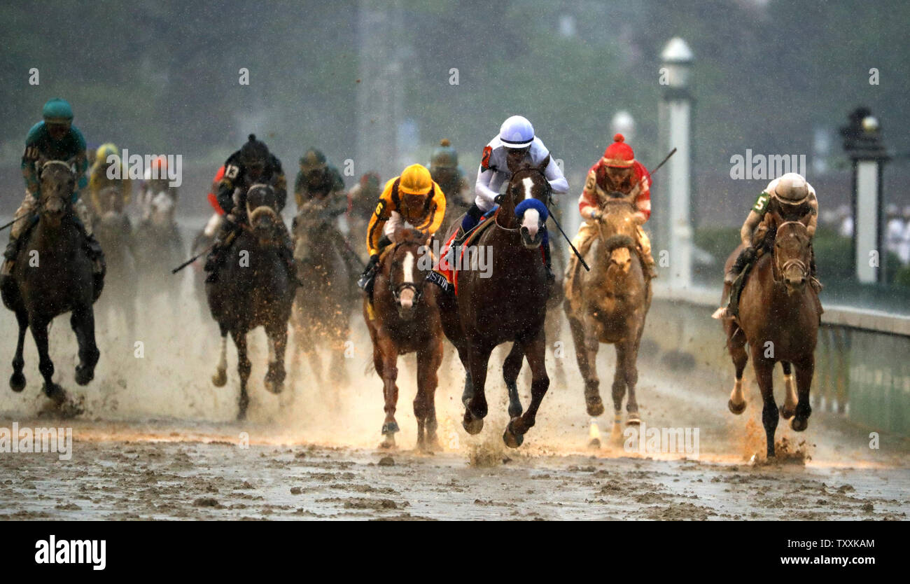 Jockey Mike Smith aboard Justify (C) crosses the finish line to win the 144th Running of the Kentucky Derby on May 5, 2018 at Churchill Downs in Louisville Kentucky. Photo by Jason Szenes/UPI Stock Photo