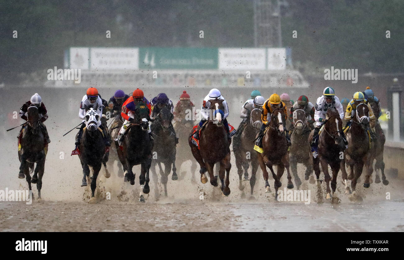 Jockey Mike Smith aboard Justify (C) leads the field of horses towards the first turn during the 144th Running of the Kentucky Derby on May 5, 2018 at Churchill Downs in Louisville Kentucky. Photo by Jason Szenes/UPI Stock Photo