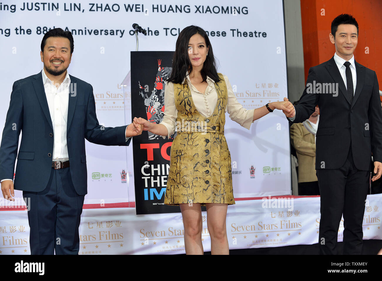 (L-R) Director Justin Lin and actors Zhao Wei and Huang Xiaoming attend the Handprint Ceremony commemorating the 88th birthday of the TCL Chinese Theatre IMAX in the Hollywood section of Los Angeles on June 3, 2015. In China, the number '8' is considered very lucky and is widely celebrated. Photo by Christine Chew/UPI Stock Photo