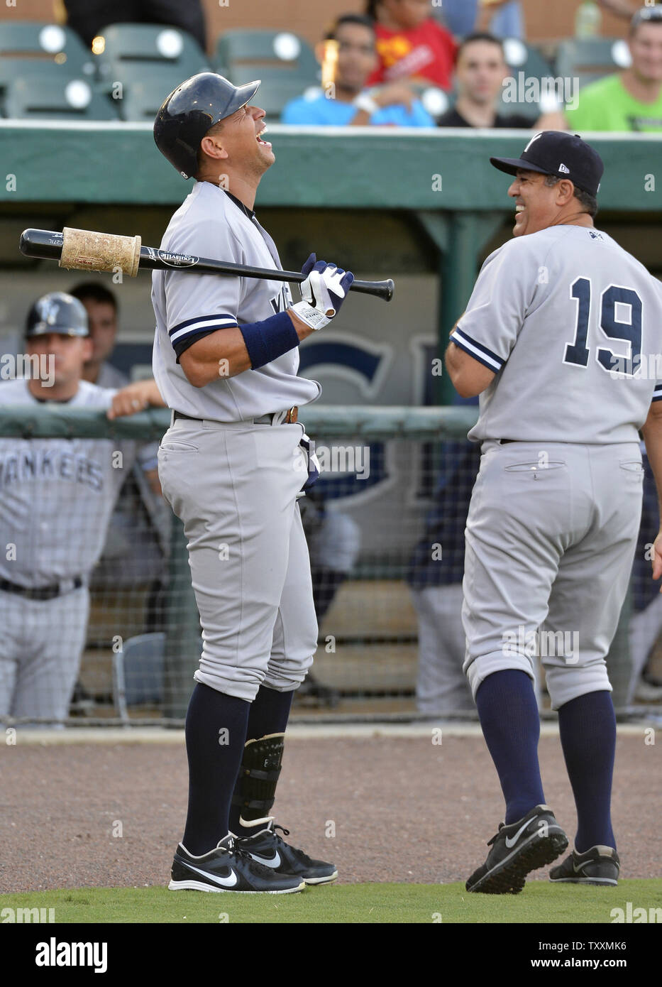 New York Yankees third baseman Alex Rodriguez (L) enjoys a New York Yankees third baseman Alex Rodriguez (L) enjoys a