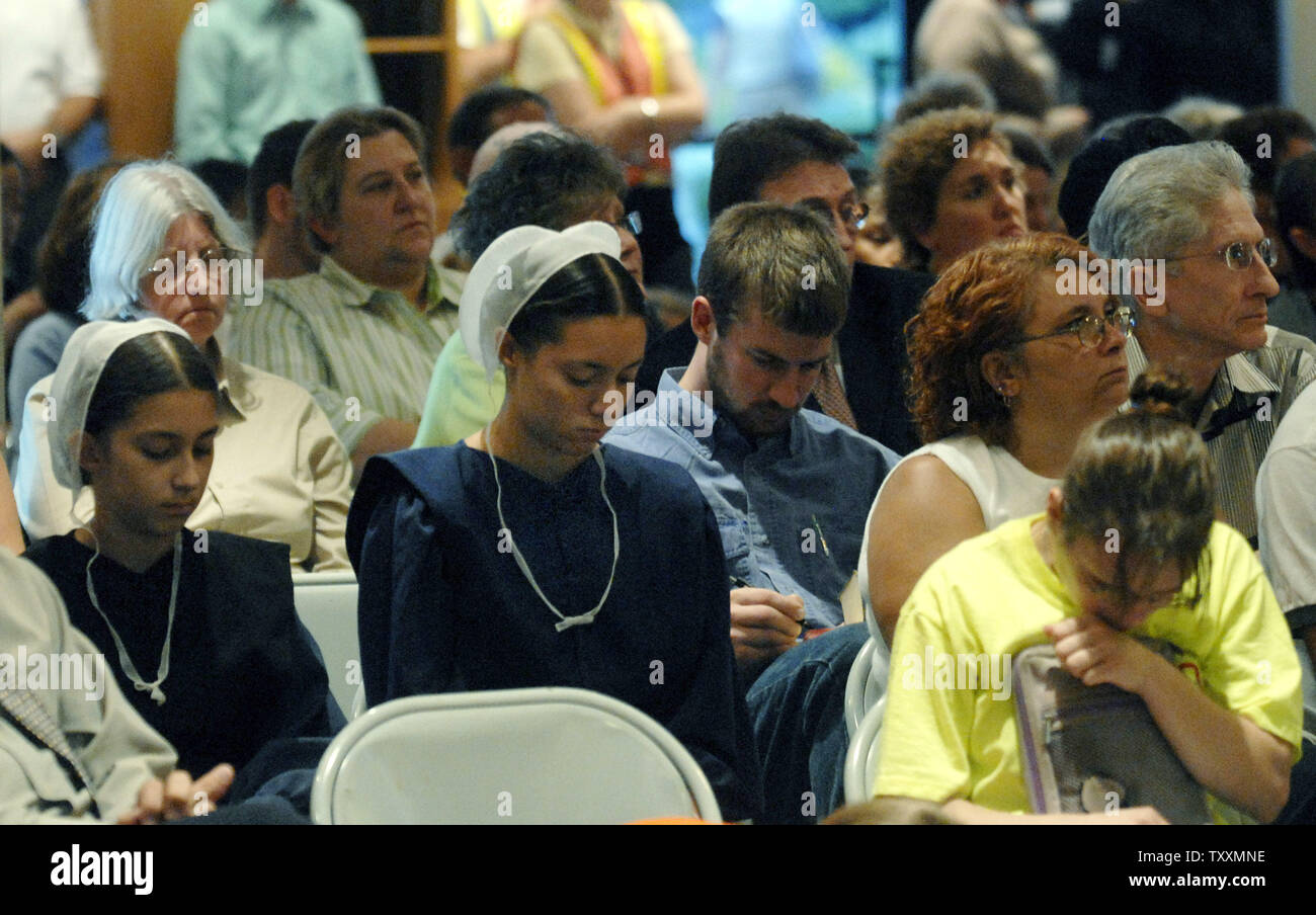 A group of Amish girls attend a prayer vigil for the victims of the Nickel Mines School House shooting, in Leola, Pennsylvania on October 3, 2006. Charles Roberts IV barricaded himself inside the schoolhouse killing several Amish girls 'execution style' before turning the gun on himself. (UPI Photo/Kevin Dietsch) Stock Photo