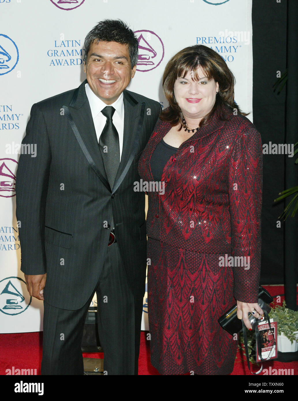 Actor George Lopez, left, and his wife, Ann, poses for photographers at the  Latin Recording Academy Person of the Year Tribute to Carlos Santana in Los  Angeles on August 30, 2004. (UPI
