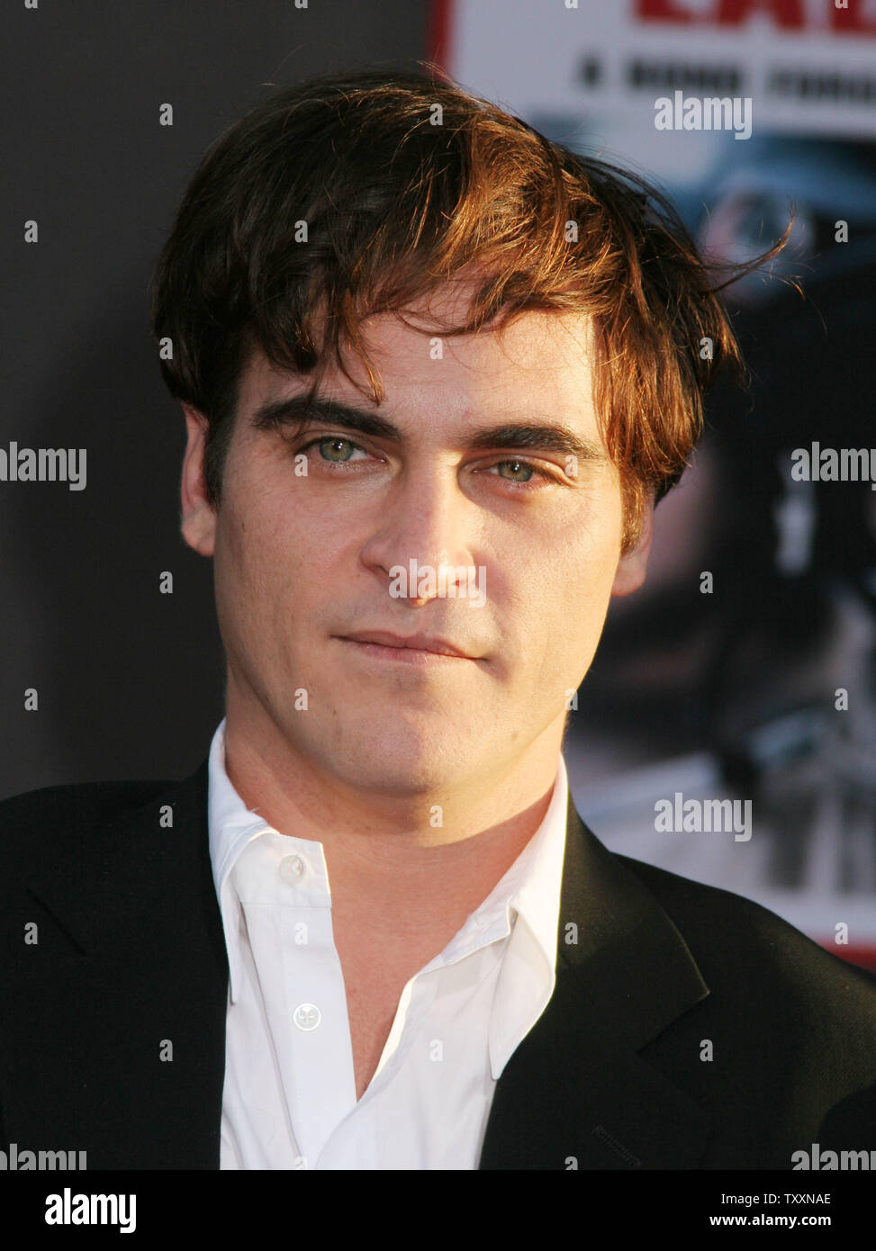 Actor Joaquin Phoenix poses for photographers at the premiere of the film, 'Ladder 49'  at The El Capitan Theatre  in Los Angeles, September 14, 2004. The Touchstone Pictures movie stars Phoenix along with John Travolta and opens in the US October 1st. (UPI Photo/Francis Specker) Stock Photo