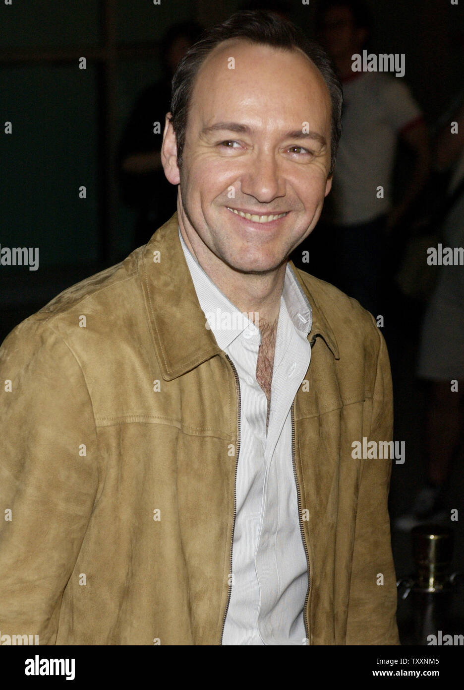 Kevin Spacey, a cast member in the motion picture crime drama "The United  States of Leland," poses as he arrives March 29, 2004 for the premiere of  the film at Arclight Theatre