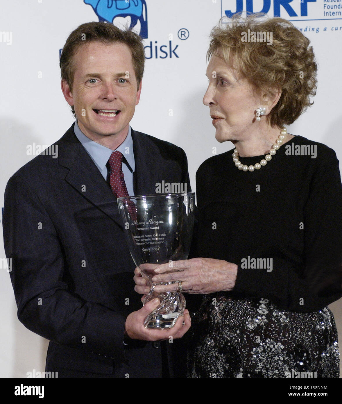 Actor Michael J. Fox (L), poses with former first lady Nancy Reagan ...