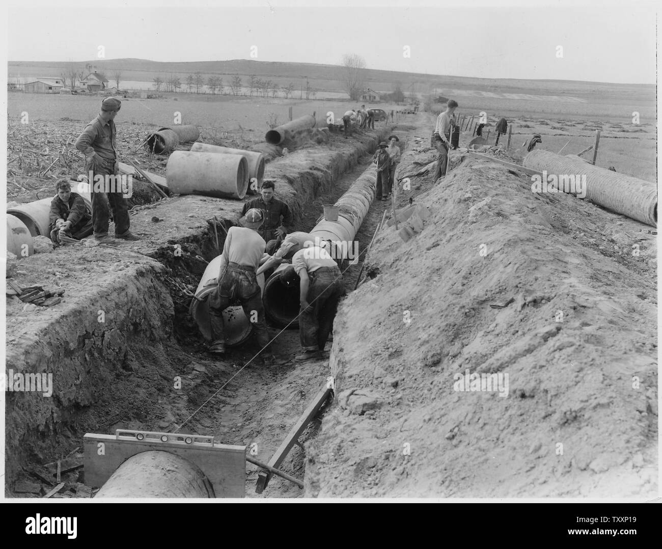 CCC Camp BR24 Boise Project, Marsing, Idaho Photo of crew placing 24 concrete pipe Stock Photo