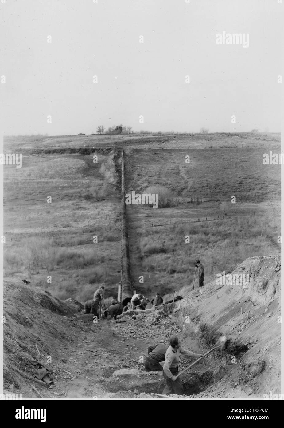 CCC Camp BR-58 Yakima-Sunnyside Project: Benton Siphon No. 1. Preparatory work to replacement of portion of 48 inch wood stave pipe with 52 inch reinforced concrete pipe. B. G. James photographer. Stock Photo