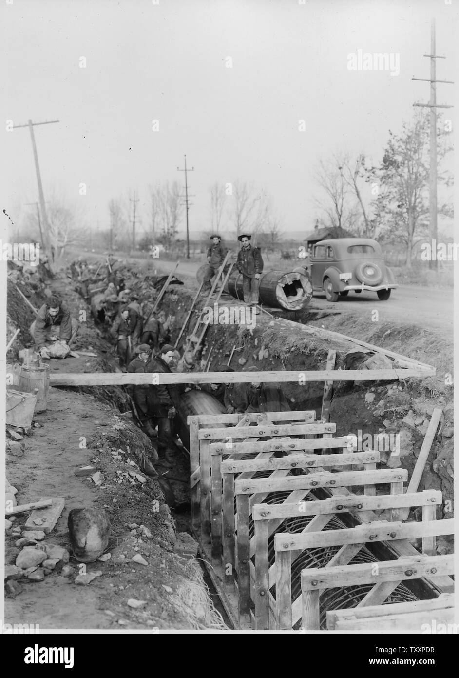CCC Camp BR-58 Yakima-Sunnyside Project: Photo of Prosser Siphon replacement. Placing inner form for 33 inch monolithic reinforced concrete pipe. B. G. James photographer. Stock Photo
